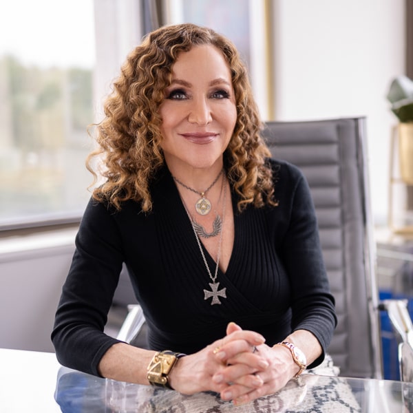 Dr Tina West at her desk